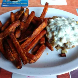 Black and Blu Burger - Cajun seasoned fresh ground round with caramelized onion and crumbled bleu cheese, served with sweet potato fries.