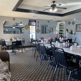 a dining room with tables and chairs