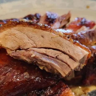 Roast ducks are made in-house and are succulent.  $16 for half a duck.