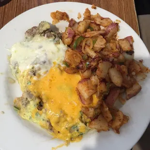 My husband ordered one of the omelettes came with potatoes or hash brown, side of toast or biscuit and gray for a good price of $9.75.