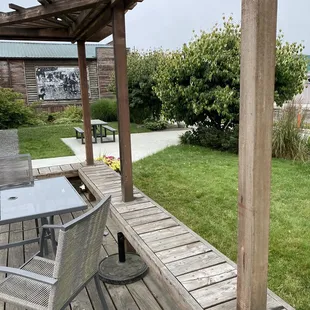 a patio with tables and chairs