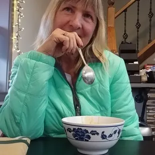 Sandy enjoys the lobster bisque.