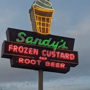 a neon sign for a frozen custard root beer