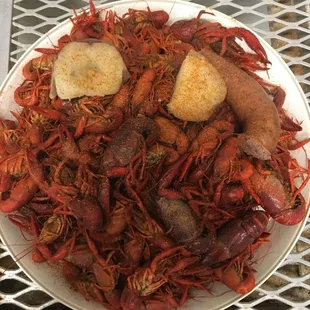 a plate of craws and sausage