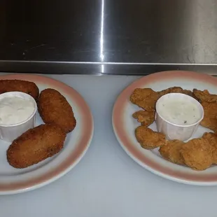 two plates of fried food