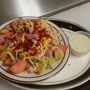 a plate of salad with dressing
