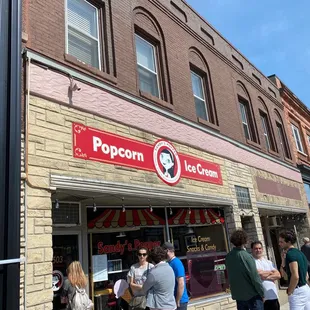 people standing outside of a store
