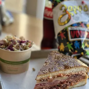 Now that&apos;s a satisfying Muffuletta slice with herby slaw and chips combo! (Oct 2024)