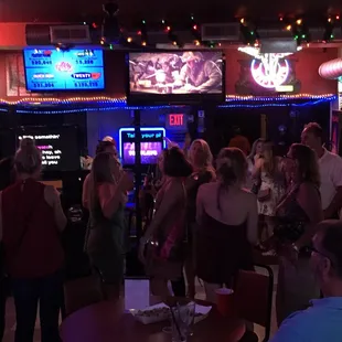 a crowd of people at a bar