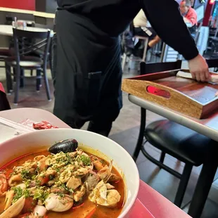Server and the interior decor of the restaurant.
