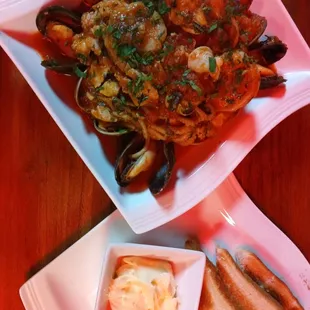 a plate of seafood and toast