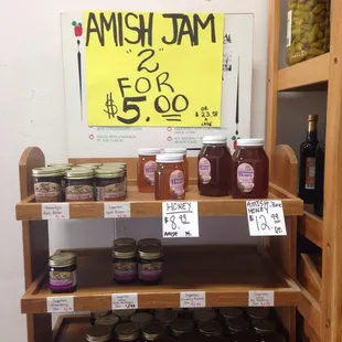 a shelf of jars of jam