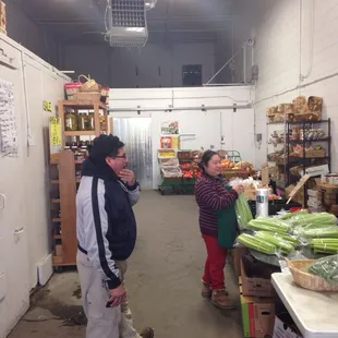 a man and woman in a grocery store