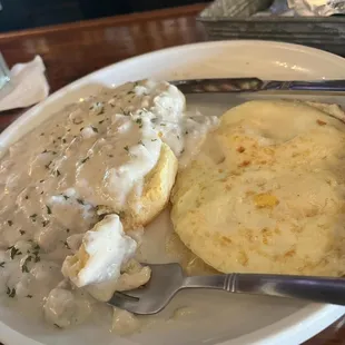 Biscuits and gravy with a fried egg on the side