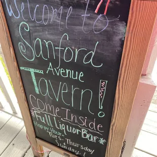 a chalkboard with a sign that says welcome to sanford avenue