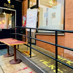 a bench on the sidewalk