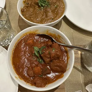 Lamb vindaloo and coconut curry chicken (top)
