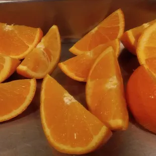 sliced oranges in a metal tray