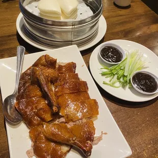 a plate of ribs and vegetables