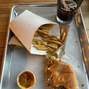 a sandwich and fries on a tray