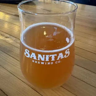 a glass of beer on a table