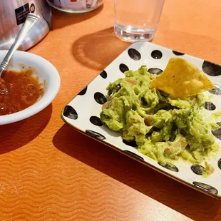 Side of guacamole and salsa (lots of flavor and heat)