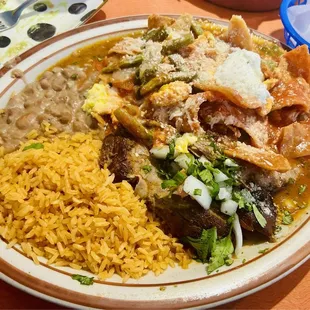 Chilaquiles Emiliano - only served on weekends (New) served with birria and I chose the refried beans here).