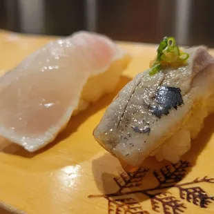 L: Medai (barrel fish), $4.50, R: Iwashi (sardine), $4.50