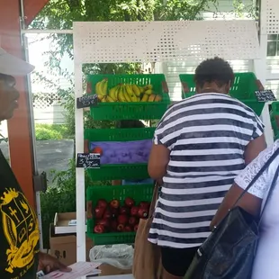 people shopping for fruit