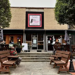 a man sitting on a bench