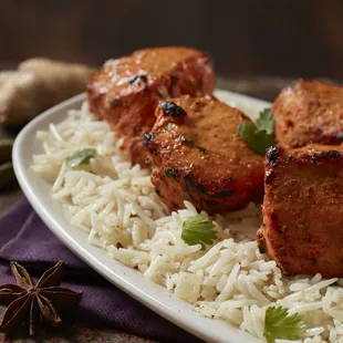 a plate of rice and meat