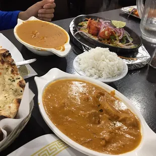 Butter Chicken up close and the Narangi Murg Tikka (tandoori grilled chicken) in the back.