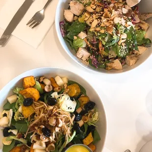 two bowls of food on a table