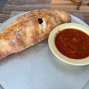 Meatball, Olive, sun dried tomato build your own calzone.