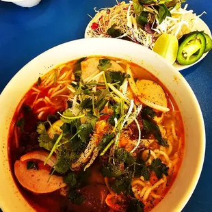 a bowl of soup and a plate of salad