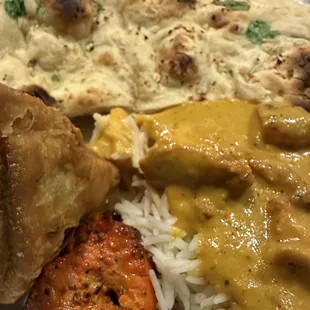 Garlic naan, veggie samosa, chicken tikki marsala over basmati rice