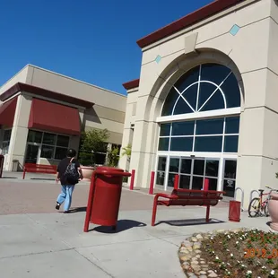 a woman walking in front of a store
