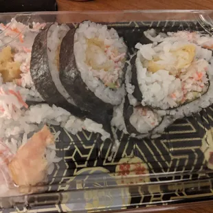 Shrimp tempura roll. No cucumber, only green shmear of avacado in 70% of pieces.