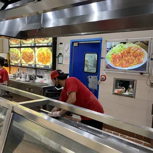 a man preparing food in a restaurant kitchen