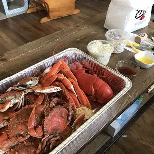 a tray of lobsters and crabs