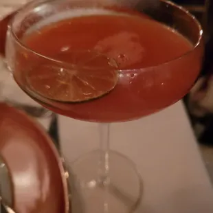 a close up of a drink in a coupe glass
