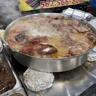 a large pan of meat and potatoes