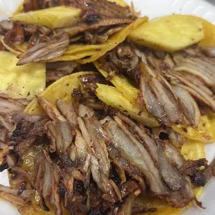 Tacos Al pastor (before I added the yummy sauces) they add a piece of pineapple and it compliments the pork taco