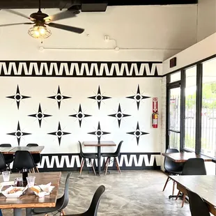 a dining area with tables and chairs