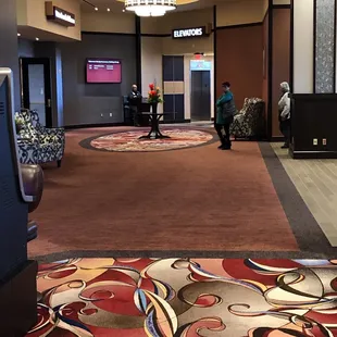 Hotel Hallway with the breakfast area to the right and elevators to take you to your room.