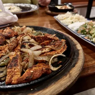 a plate of chicken and vegetables