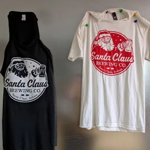 two t - shirts hanging on a wall