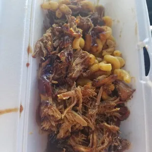 pulled pork and corn in a styrofoam container