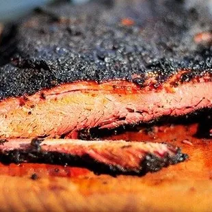 a piece of bbq on a cutting board