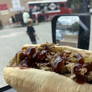 YUM! Pulled Pork Sandwich, Hot BBQ sauce &amp; Green Chili!